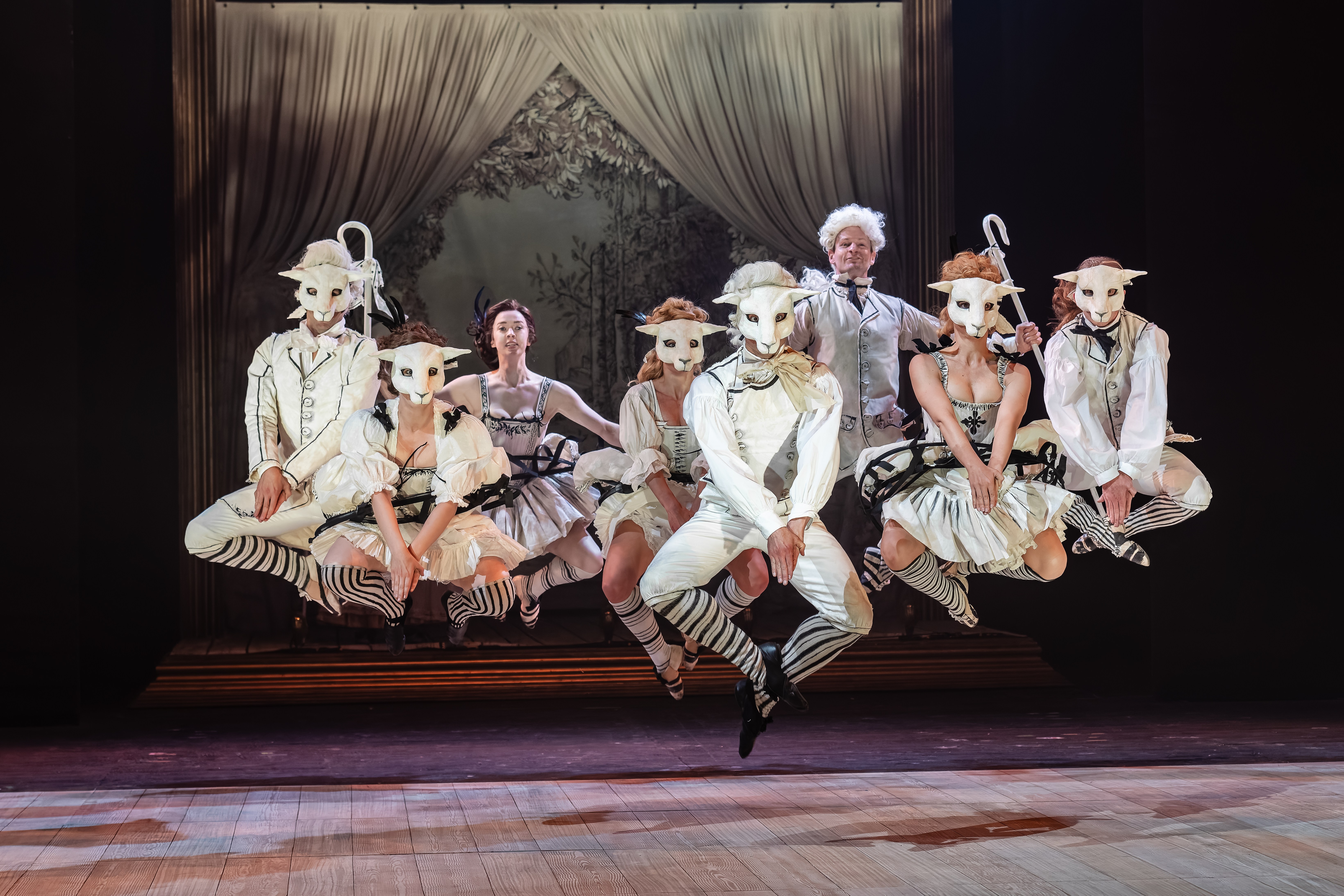 A scene from Tchaikovsky's The Queen of Spades opera, featuring dancers in sheep masks.