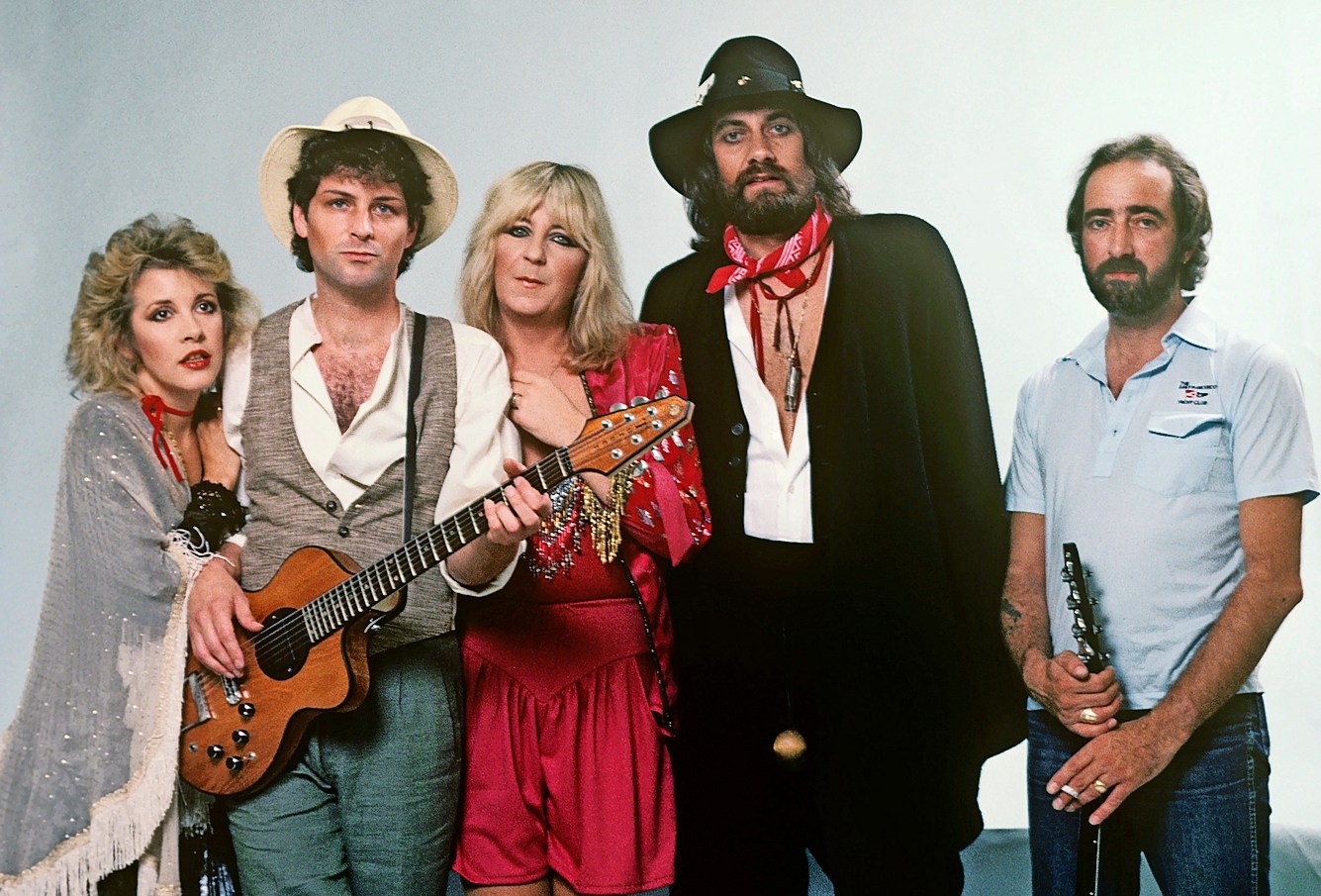 Photo of Fleetwood Mac band members posing together.