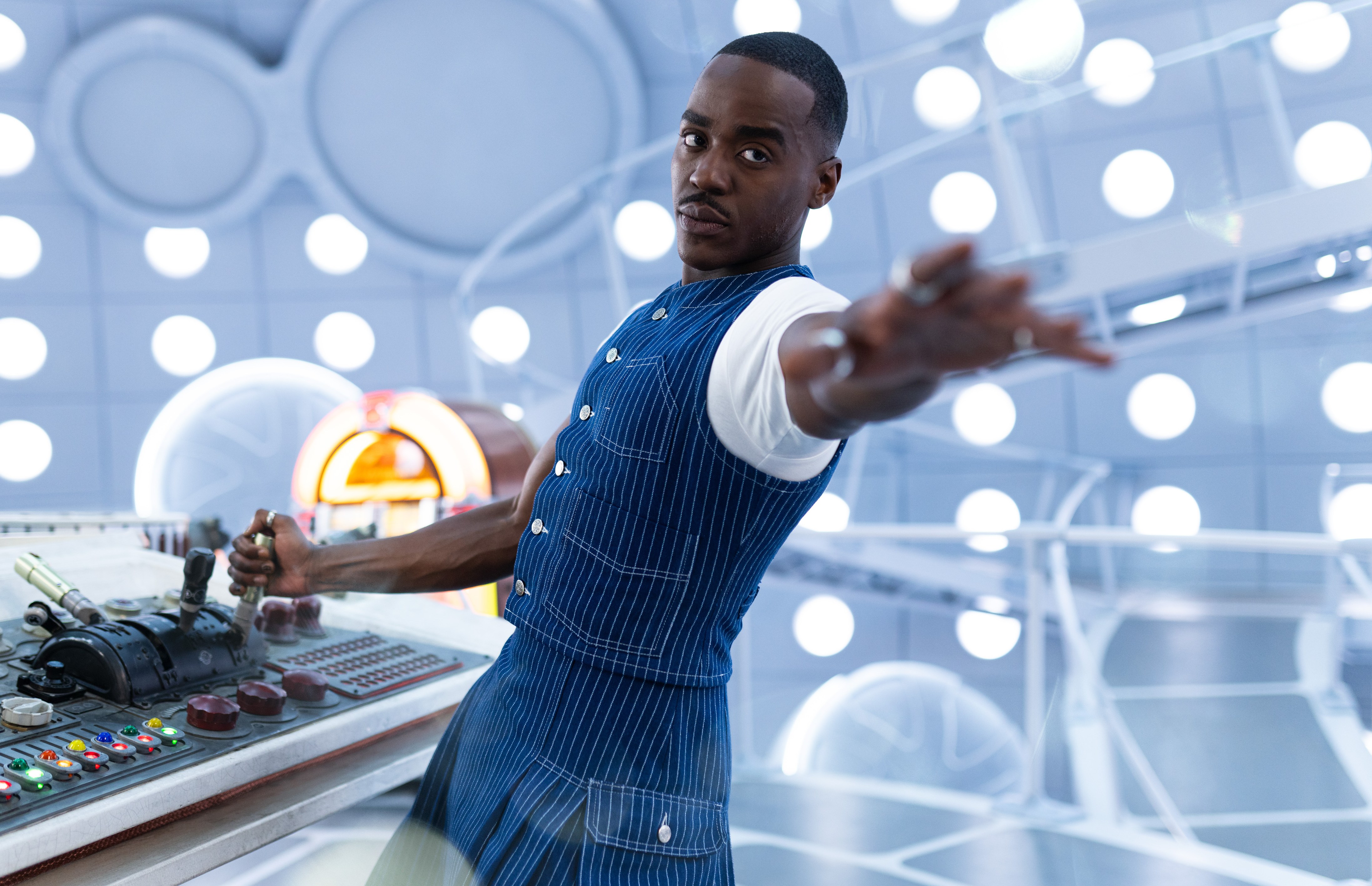 The Doctor operating the TARDIS console.