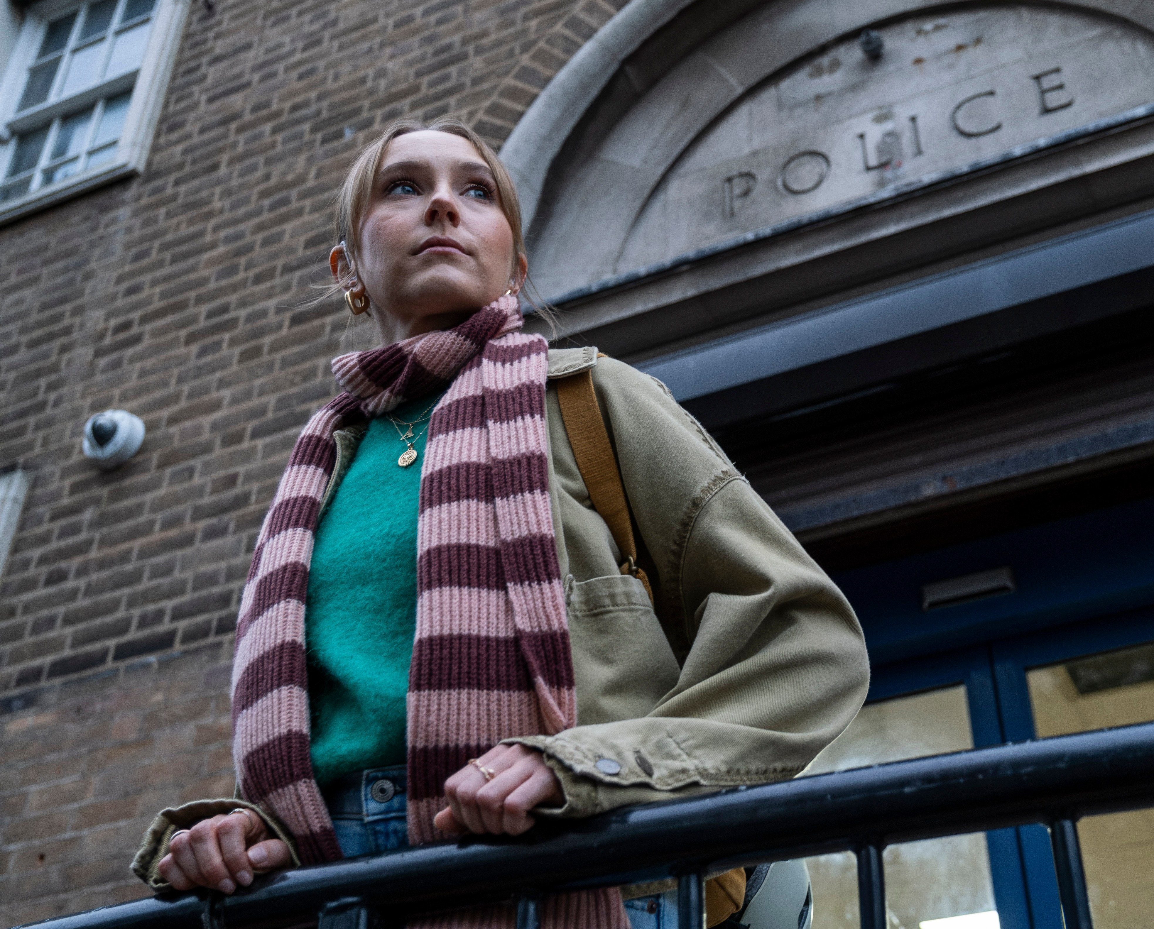 Rose Ayling-Ellis as Alison Brooks outside a police station.