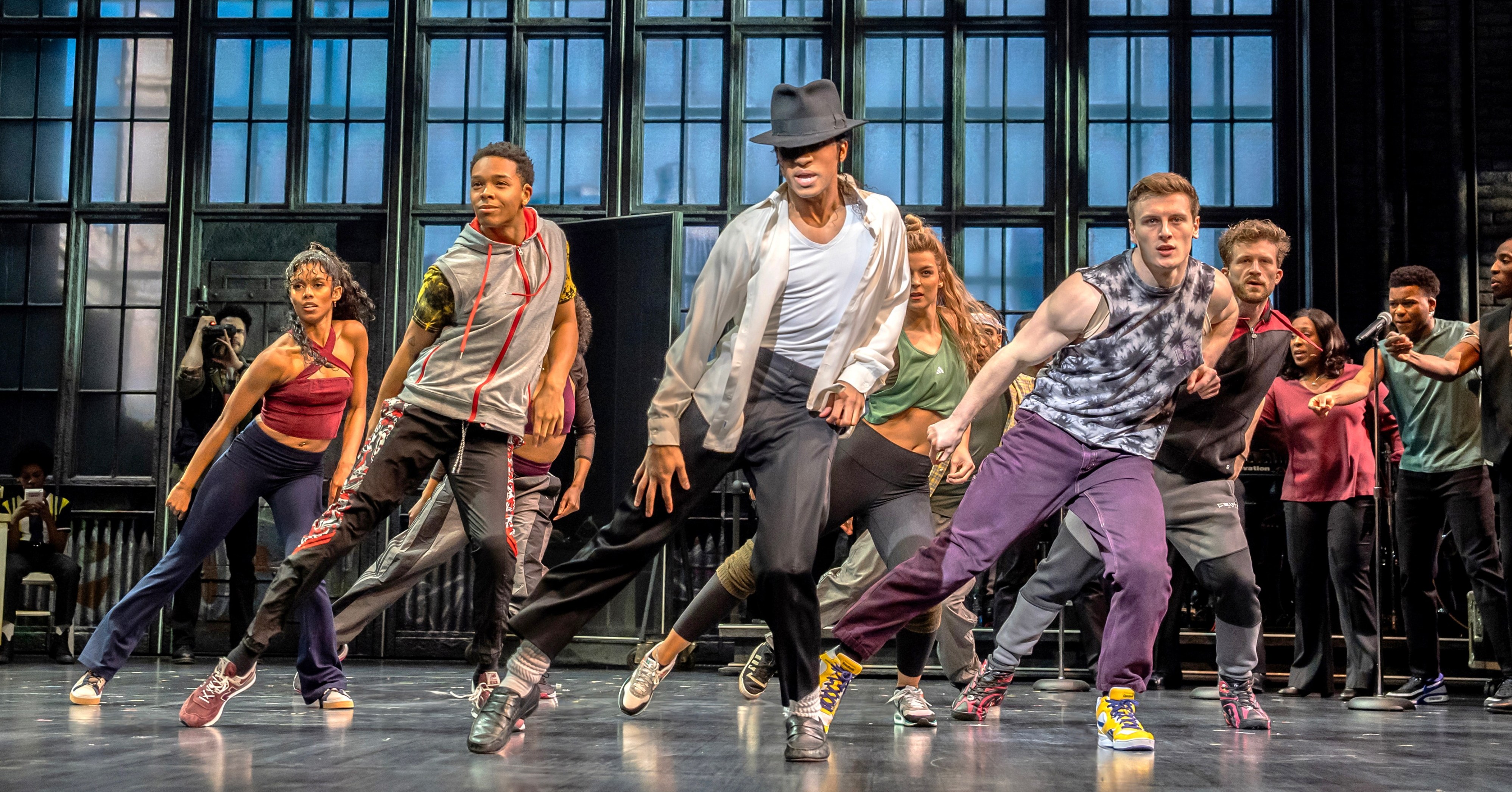 A scene from MJ the musical showcasing dancers on stage.